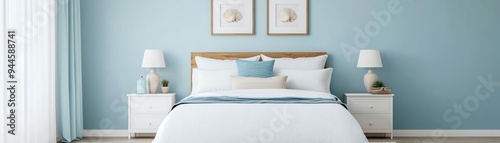A serene bedroom featuring a light blue wall, a cozy bed with white linens, and elegant decor for a calming atmosphere.