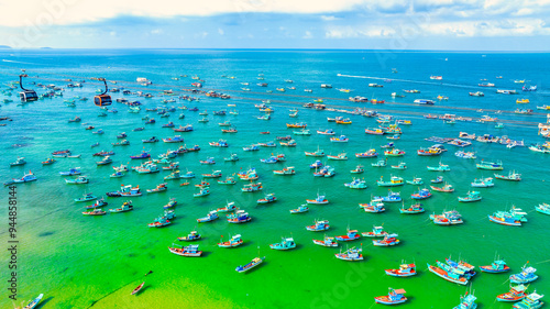 Aerial view of wooden fishing boat on sea and An Thoi town in Phu Quoc Island, Vietnam. photo