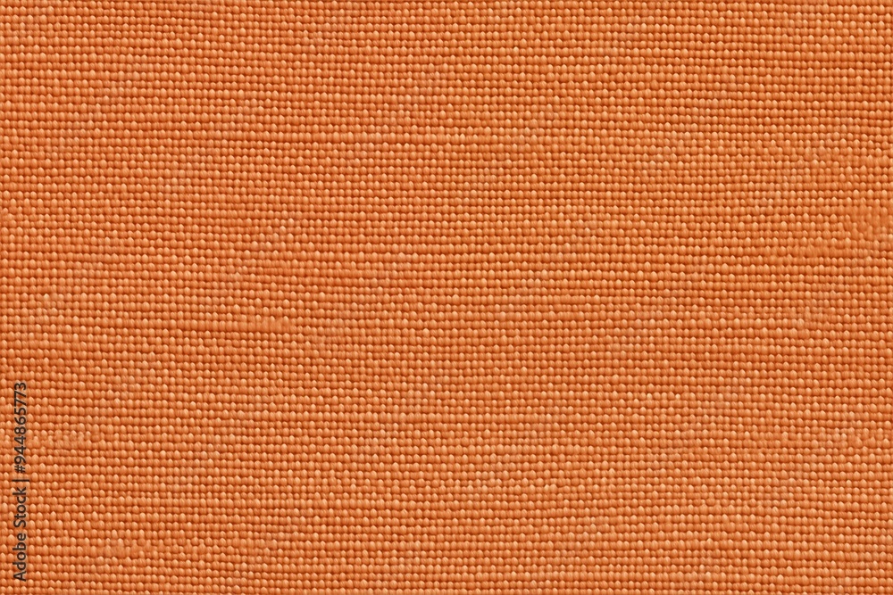 Fototapeta premium Textured orange batiste cotton fabric, showcasing a woven pattern and a warm hue.