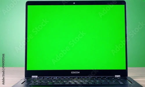 Wallpaper Mural Laptop with Green Screen on a Wooden Table Torontodigital.ca