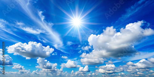 Clear blue sky with a few white clouds, serene weather, bright sunlight