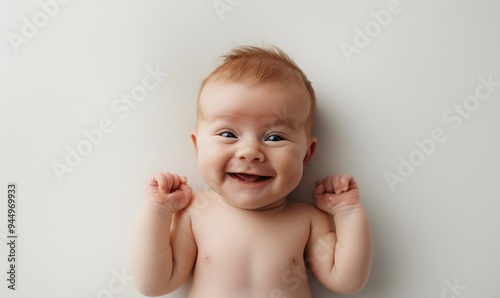 Portrait newborn baby happy over white background, topview. 