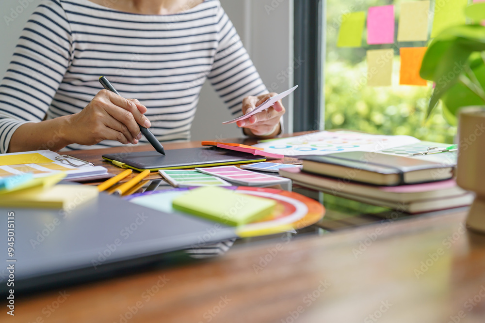 Teamwork brainstorming Creative idea Business project. Business People meeting taking notes while discussing with Color swatch samples to share idea Teamwork brainstorming Creative idea Business project. Business People meeting taking notes while discussing with Color swatch samples to share idea