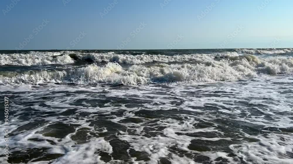 A child swims in the Sea of Azov. A boy jumps into the sea waves from the beach. The boy dives into the foaming wave. The delight of a child from a vacation at the sea. Happy moments with children. 4K A child swims in the Sea of Azov. A boy jumps into the sea waves from the beach. The boy dives into the foaming wave. The delight of a child from a vacation at the sea. Happy moments with children. 4K