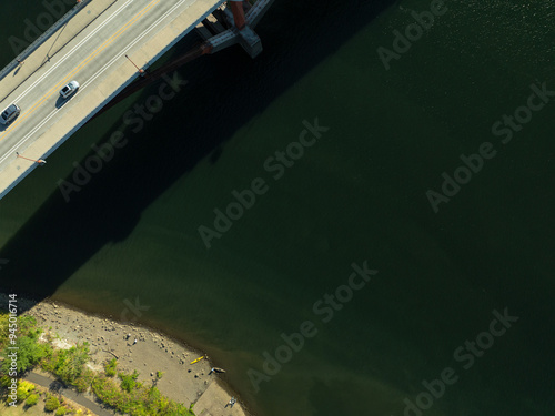 A bridge over a river with a car on it