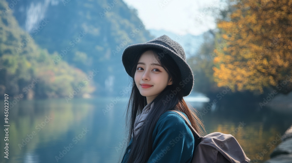 Korean girl posing for a travel photo in front of a scenic riverbank, the water reflecting Korean girl posing for a travel photo in front of a scenic riverbank, the water reflecting