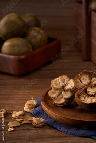 Fotografie Chinese traditional medicine monk fruit, wooden background atmosphere