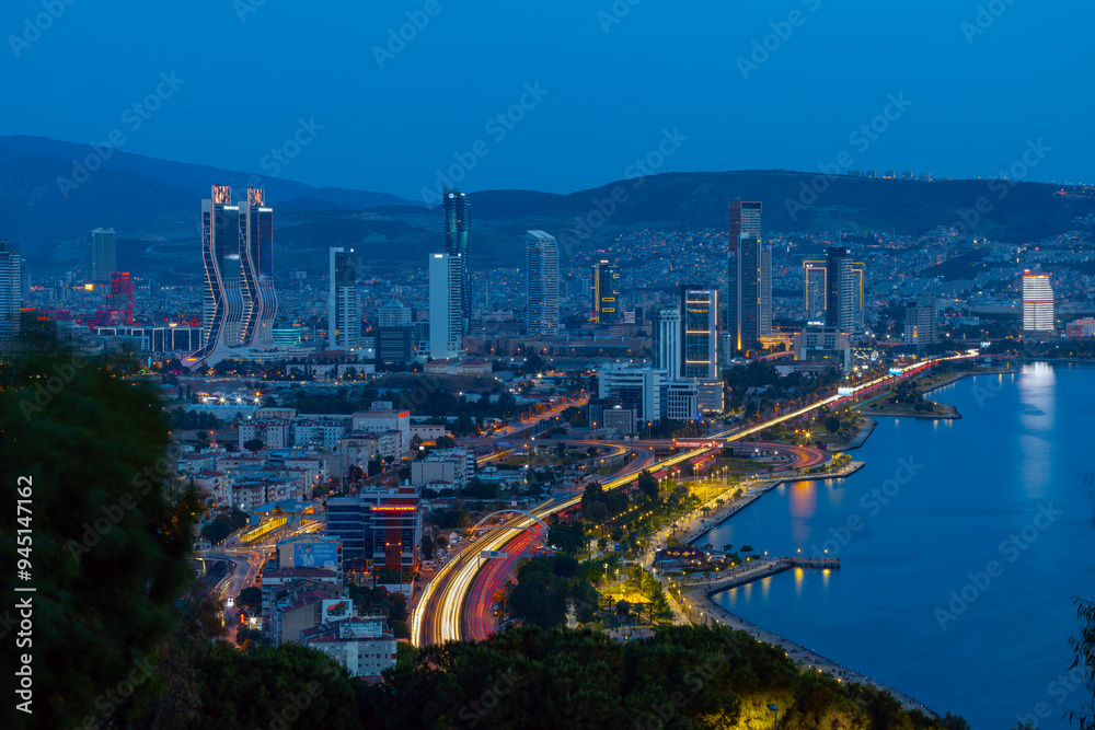 Fototapeta premium View of Izmir Bay in the evening from the high hill of Bayrakli. Long exposure, low light.