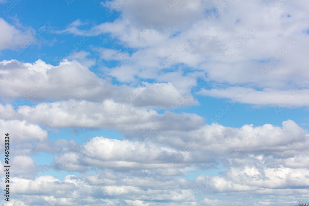White clouds against a blue sky White clouds against a blue sky