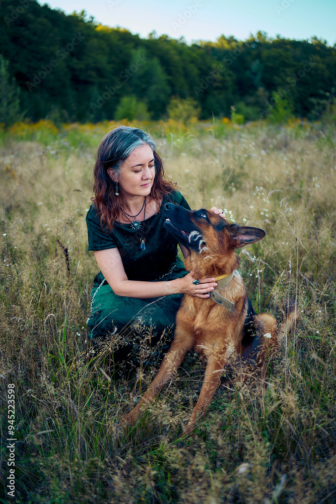 a woman in a Whimsical Aesthetic style dress with a German shepherd in a field a woman in a Whimsical Aesthetic style dress with a German shepherd in a field