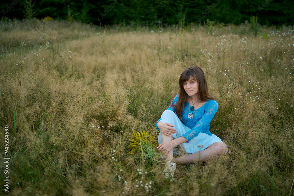 woman in whimsical aesthetic style dress in field in summer at sunset woman in whimsical aesthetic style dress in field in summer at sunset