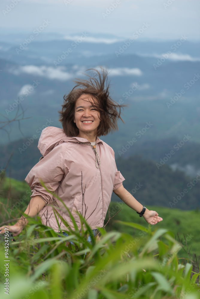 Traveler sightseeing the beautiful scenery of nature and mist during time the sunrise Traveler sightseeing the beautiful scenery of nature and mist during time the sunrise
