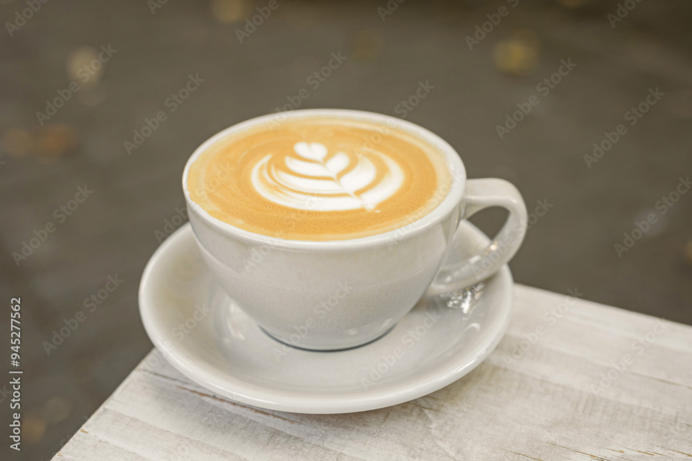 A cup of cappuccino on the table outside A cup of cappuccino on the table outside