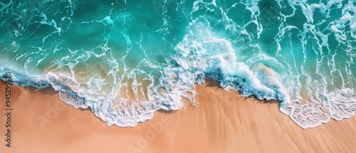 Serene Scene of Crystal-Clear Ocean Waves Meeting Sandy Shoreline