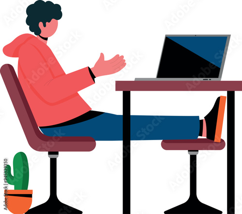 The boy is sitting at the working table.