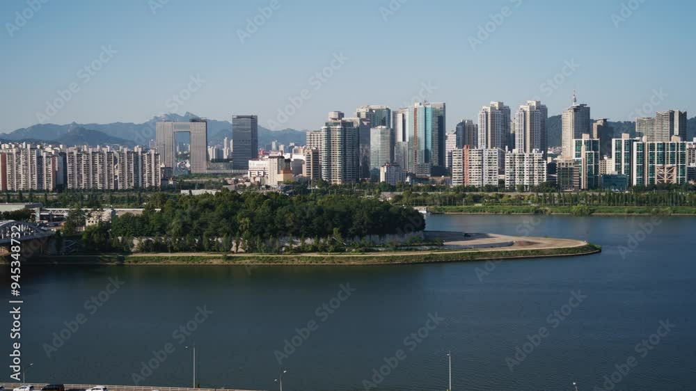 Panoramic View of Nodeul Island Park and Seoul Skyline Over the Han River with paning. Panoramic View of Nodeul Island Park and Seoul Skyline Over the Han River with paning.