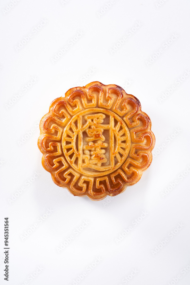 Traditional Cantonese style egg yolk lotus seed paste mooncake for Mid-Autumn Festival on white background Traditional Cantonese style egg yolk lotus seed paste mooncake for Mid-Autumn Festival on white background