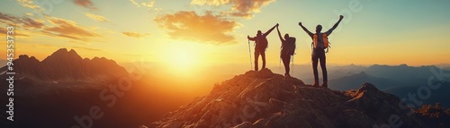 A group of hikers reaching the summit of a mountain at sunrise, celebrating with arms raised, dynamic shot, warm tones, natural light, panoramic view photo