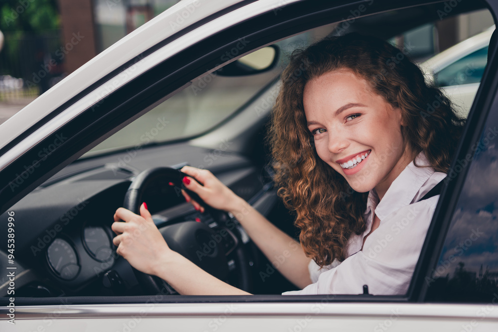 Photo of attractive cute lady driver dressed white shirt smiling riding car going gas station outdoors urban city street Photo of attractive cute lady driver dressed white shirt smiling riding car going gas station outdoors urban city street