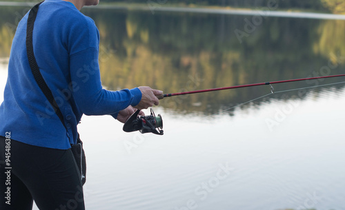 fishing by the shore women outdoor acticvities mountain lake slective focus