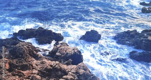 panorama view from above where the sea waves crashes on the rocky coast under a blue sky, concept of holiday, Porto Cesario Lecce Italy photo