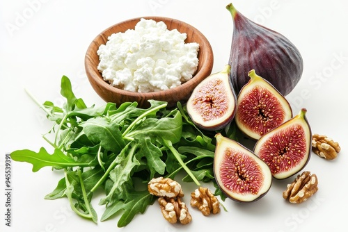 A fresh arrangement of figs, walnuts, arugula, and cottage cheese for a healthy meal.