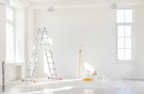 Photography Empty room with painting equipment, brushes and colors for wall renovation during home or office construction project