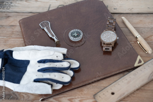 Personal Seatime Logbook, Sailing Leather Gloves without fingertips for marine enthusiasts. Seafarer documentation, compass, yacht captain accessories, adventure at sea, marine safety photo