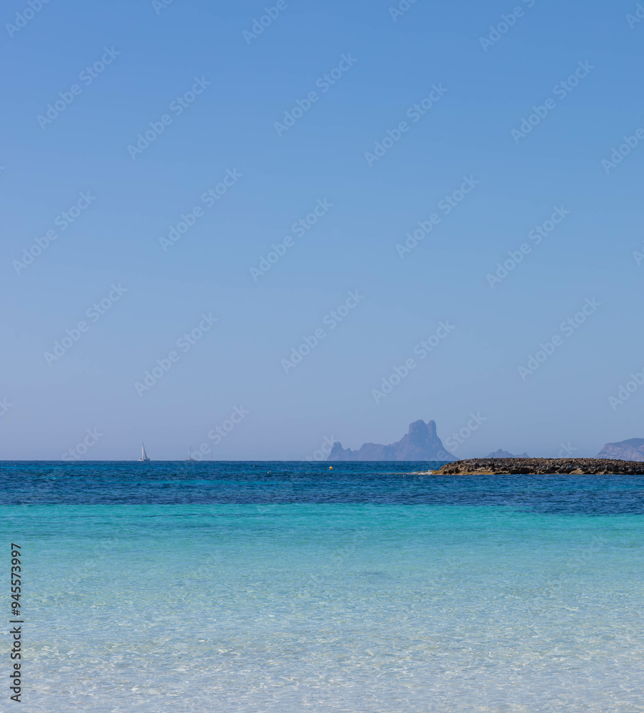View of Es Vedra, from the Illa des Conills beach on Formentera. View of Es Vedra, from the Illa des Conills beach on Formentera.