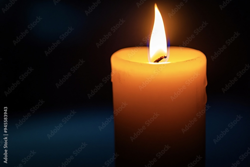 Single candle is burning brightly in a dark room, providing a warm glow and creating a sense of peace and tranquility Single candle is burning brightly in a dark room, providing a warm glow and creating a sense of peace and tranquility