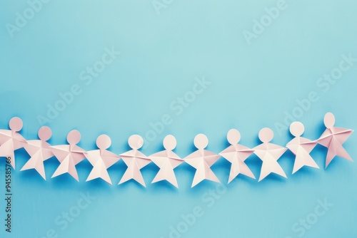 Chain Of People Made of Paper on Blue Background: Unity and Strength Concept Chain of people made of paper on blue background. Horizontal composition with copy space. Unity and strength concept.