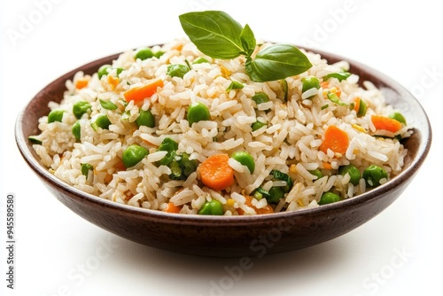 A bowl of vegetable fried rice garnished with a basil leaf.