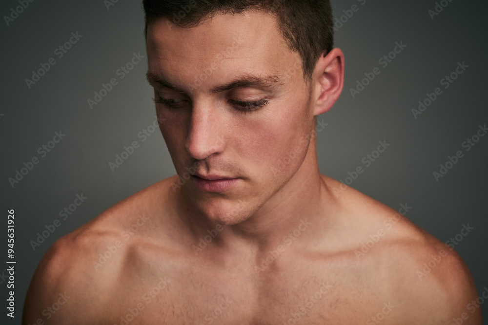 Skincare, health and face of man in studio for wellness, facial treatment and grooming. Dermatology, salon and isolated person with beauty, confidence and pride for natural skin on gray background