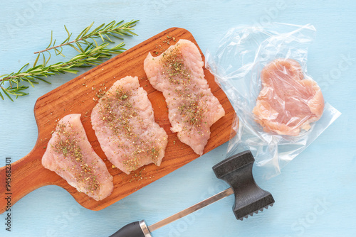 Chicken chops for barbecue on wooden background.
