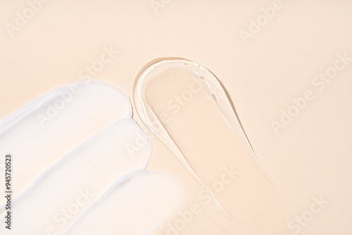 Smears of cream and gel textures on beige background