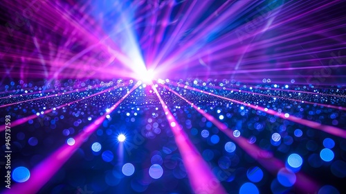 Bright blue and violet laser beams illuminating a black background photo