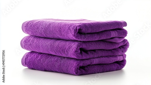 Stack of purple towels on a white background, isolated