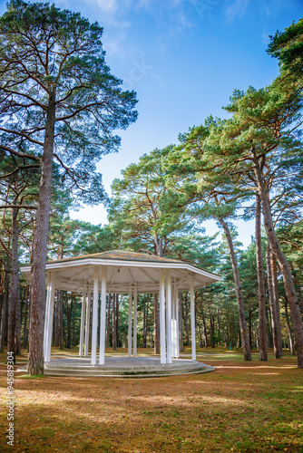 A classical-style rotunda in Birute Park, Palanga, surrounded by tall pine trees photo