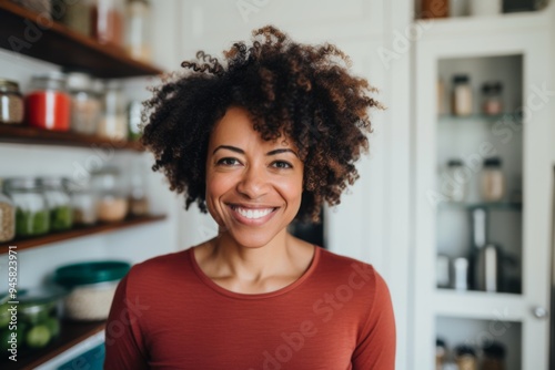 Portrait of a middle aged African American fit woman in healthy kitchen