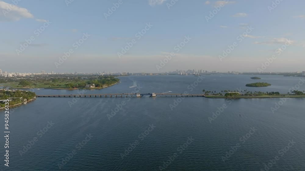 Aerial view of tranquil Biscayne Bay with a picturesque skyline and bridge, Bay Harbour Islands, United States. Aerial view of tranquil Biscayne Bay with a picturesque skyline and bridge, Bay Harbour Islands, United States.