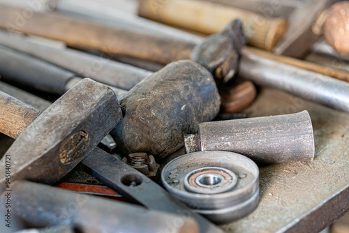 Closeup photo shoot of different nesessary tools and parts in every man's garage.Auto check up and car service shop concept.Different type of tools, especially wrenches.