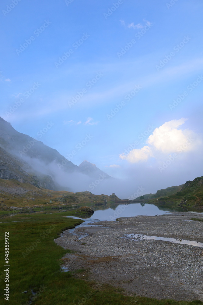 Mountain lake in the Ossau Valley on the way from Bayssellance mountain hut on GR10 hiking trail, Pyrenees Mountain lake in the Ossau Valley on the way from Bayssellance mountain hut on GR10 hiking trail, Pyrenees