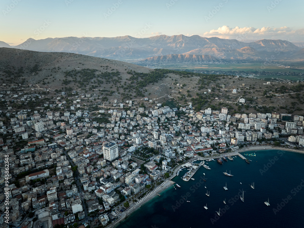 Fototapeta premium Aerial panorama of Sarande (aka Saranda), Albania. Photo taken with drone at sunset