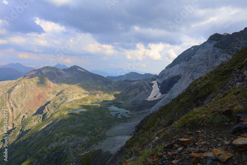 Turquoise mountain lake Barroude in French Pyrenees on HRP long-distance hiking trail