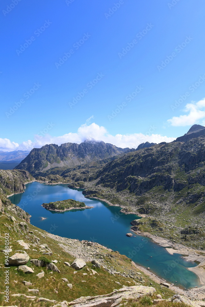 Mountain lake Lac de Mar in Aiguestortes and Sant Maurici National Park, GR11 long-distance hiking trail, Pyrenees Mountain lake Lac de Mar in Aiguestortes and Sant Maurici National Park, GR11 long-distance hiking trail, Pyrenees
