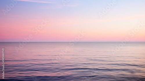 Vibrant Twilight Over Still Ocean With Reflective Waters and Gradient Sky