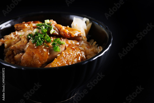 Grilled Chicken teriyaki rice Japanese food isolated in black background