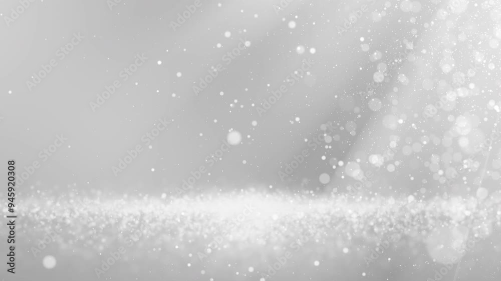 Glittering silver white particles create a mesmerizing wave on white background , perfect for elegant design projects.