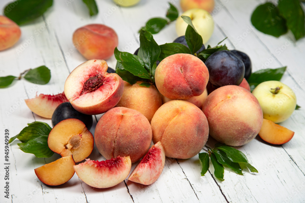 Peaches and apples on wooden background