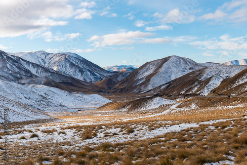 Scenic view of mountain range in Lindis Pass, New Zealand. photo